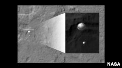 An image from a satellite obiting Mars of Curiosity's landing parachute