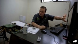 John Villar speaks during an interview at his office in Caracas, Venezuela, Tuesday, Dec. 12, 2017. (AP Photo/Fernando Llano)