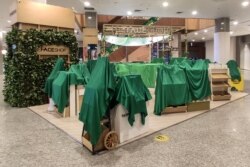 Cosmetics displays are seen covered at a shopping center in Yangon, Feb. 1, 2021, after Myanmar's military seized power in a bloodless coup earlier in the day.