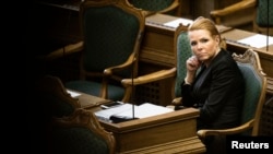 Denmark's Minister of Immigration and Integration Inger Stojberg listens to the debate in the Danish Parliament, Jan. 26, 2016. 