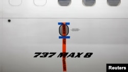 FILE - A seal is seen on Garuda Indonesia's Boeing 737 Max 8 airplane parked at the Garuda Maintenance Facility AeroAsia, at Soekarno-Hatta International airport near Jakarta, Indonesia, March 13, 2019.