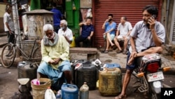 Ethnic Chinese Indians vendors selling their ware at a roadside market in Kolkata, India, June 19, 2020, as India's prime minister is meeting top opposition leaders as the government tries to lower tensions with China. 