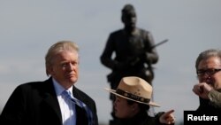FILE - President Donald Trump pumps his fist as he finishes speaking during an event at the Whirlpool Corporation facility in Clyde, Ohio, August 6, 2020.