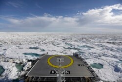 FILE - The Finnish icebreaker MSV Nordica sails through sea ice floating on the Victoria Strait along the Northwest Passage in the Canadian Arctic Archipelago, July 21, 2017.
