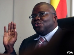 FILE - Zimbabwe's then-finance minister Tendai Biti talks at a news conference in Harare, Feb. 18, 2009.