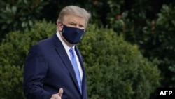 FILE - President Donald Trump leaves the White House for Walter Reed National Military Medical Center on the South Lawn of the White House in Washington, Oct. 2, 2020. 