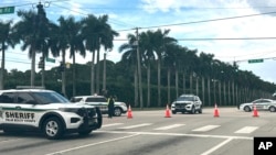 ফ্লোরিডার ওয়েস্ট পাম বিচে ট্রাম্প ইন্টারন্যাশনাল গলফ ক্লাবের বাইরে রবিবার গুলিবর্ষণের খবরের পর কাউন্টি শেরিফের গাড়ি দেখা যাচ্ছে। ফটোঃ ১৫ সেপ্টেম্বর, ২০২৪।