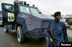 A Congolese policeman patrols as opposition activists march to press President Joseph Kabila to step down in the Democratic Republic of Congo's capital Kinshasa, Sept. 19, 2016.