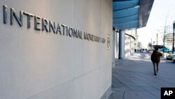 FILE - The International Monetary Fund (IMF) headquarters is seen, Dec. 19, 2016, in Washington. 
