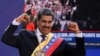 Venezuela's President Nicolas Maduro gestures to supporters after he was sworn in for a third six-year term, in Caracas, Venezuela, Jan. 10, 2025. 
