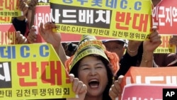 A resident in a rural South Korean town shouts slogans to protest a plan to deploy an advanced U.S. missile defense system called Terminal High-Altitude Area Defense, or THAAD, in their neighborhood, in Seoul, South Korea, Oct. 5, 2016.