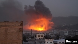 Smoke billows from a fire at a Houthi-controlled military site after it was hit by a Saudi-led airstrike in San'aa, Yemen, June 3, 2015. 