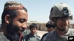 Locals and NATO troops talk in Afghanistan, Oct 2010