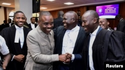 Lawyers celebrate their win in the Supreme Court of Uganda after the court ruled that civilians should no longer be charged in the military courts, at the judiciary headquarters in Kampala, Uganda, Jan. 31, 2025. 