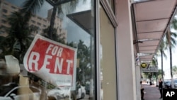 FILE - In this July 13, 2020 file photo, a For Rent sign hangs on a closed shop during the coronavirus pandemic in Miami Beach, Fla. Having endured what was surely a record-shattering slump last quarter, the U.S. economy faces a dim outlook as a…