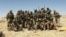 FILE - A photo published by the Security Service of Ukraine purports to show Wagner Group mercenaries at an unidentified location.