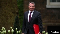 FILE - British Trade Minister Liam Fox arrives for a Brexit subcommittee meeting at Downing Street in London, Britain, May 2, 2018. 
