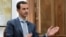 Syria's President Bashar al-Assad is interviewed Feb. 10, 2017, in Syria. Thousands of Afghans from Iran are involved in the Syrian conflict, many sent against their will, Human Rights Watch reports.