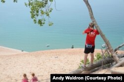 Mikah Meyer captures a shot of a sailboat from a high vantage point at Sleeping Bear Dunes National Lakeshore in Glen Arbor, Michigan.