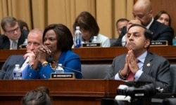 Members of the House Intelligence Committee listen as former special counsel Robert Mueller testifies about his investigation into Russian interference in the 2016 election, on Capitol Hill in Washington, July 24, 2019.