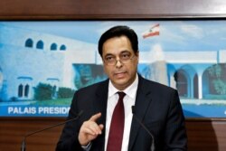 Lebanese Prime Minister Hassan Diab speaks during a news conference after his government was announced, at the Presidential Palace in Baabda, east of Beirut, Lebanon, Jan. 21, 2020.