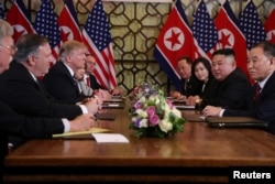 North Korea's leader Kim Jong Un and U.S. President Donald Trump attend the extended bilateral meeting in the Metropole hotel with U.S. Secretary of State Mike Pompeo, White House National Security Adviser John Bolton, acting White House Chief of Staff Mick Mulvaney, North Korean Foreign Minister Ri Yong Ho and Kim Yong Chol, Vice Chairman of the North Korean Workers' Party Committee, during the second North Korea-U.S. summit in Hanoi, Vietnam, Feb. 28, 2019.