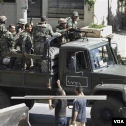 Pasukan keamanan Suriah dilaporkan melakukan penggerebekan aktivis oposisi di pinggiran Damaskus (foto: dok).