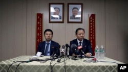 Ambassador of the Permanent Mission of the Democratic People's Republic of Korea to the United Nations Jang Il Hun, right, is joined by councilor Kwon Jong Gun as he speaks during a new conference, July 28, 2015, at the DPRK mission in New York. 