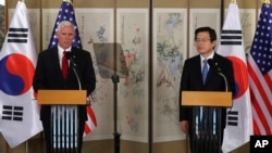 U.S. Vice President Mike Pence, left, speaks as South Korea's acting President and Prime Minister Hwang Kyo-ahn listens during a joint news conference after their meeting in Seoul, South Korea, Monday, April 17, 2017.