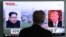 A man watches a TV screen showing file footage of President Trump, right, and North Korean leader Kim Jong Un at the Seoul Railway Station in Seoul, South Korea, May 16, 2018.