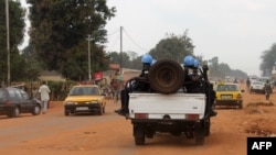 FILE - Soldiers of the U.N. force known by its French acronym MINUSCA are seen sitting on a vehicle in Bangui, Central African Republic.