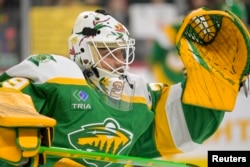 Minnesota Wild goalie Marc-Andre Fleury wears his Native American Heritage mask in warmups in Saint Paul, Minnesota, on Nov. 24, 2023. (Nick Wosika/USA TODAY Sports)