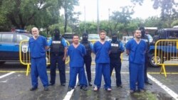 FILE - In this Oct. 17, 2018 photo, provided by the Nicaraguan National Police, prisoners detained and imprisoned during uprisings against the government of President Daniel Ortega, are shown to the press in Managua, Nicaragua.