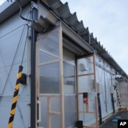 Entrance to one of the hastily erected temporary houses.