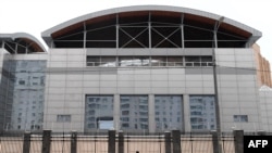 FILE - A man walks past the headquarters of the Russian General Staff's Main Intelligence Department (GRU) in Moscow, Dec. 30, 2016.