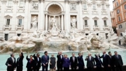G20 leaders toss a coin into Rome's iconic Trevi Fountain on the sidelines of the G-20 summit in Rome, Oct. 31, 2021.