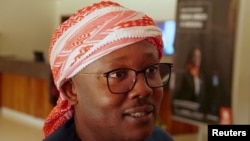 FILE - Former Prime Minister and presidential candidate Umaro Cissoko Embalo chats with his supporters and members of his campaign team, after the results of the first-round poll, at a hotel lobby in Bissau, Guinea-Bissau, Nov. 27, 2019. 