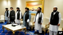 FILE - Members of a Taliban peace negotiation team are pictured in Doha, Qatar, Nov. 21, 2020.