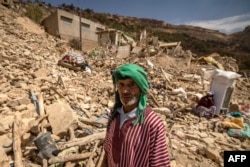 An elderly villager looks on in the earthquake-hit village of Douzrou in al-Haouz province in the High Atlas mountains of central Morocco on September 12, 2023.