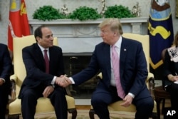 President Donald Trump, right, meets with Egyptian President Abdel-Fattah el-Sissi in the Oval Office of the White House, April 9, 2019, in Washington.