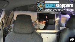 This undated photo released by New York City police shows the suspect in the fatal shooting of UnitedHealthcare CEO Brian Thompson on Dec. 4, 2024, in a taxi. Part of the image was blurred by the source. An arrest was made Dec. 9.