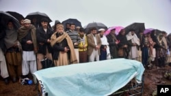 Villagers carry offer prayers at the funeral of a boy killed by Indian shelling, at a village in Hatian Bala, 40 kilometers from Muzafarabad, capital of Pakistani-controlled Kashmir, March 2, 2019.