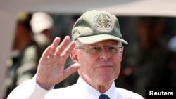 Peru's then-president, Pedro Pablo Kuczynski, participates in a military event at Rimac army headquarters in Lima, March 20, 2018.