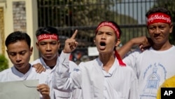 FILE - Protestors demand the release of all remaining political prisoners outside Insein Prison in Yangon, Myanmar, Jan. 22, 2016.
