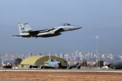 FILE - A U.S. Air Force F-15 fighter jet takes off from Incirlik Air Base, near Adana, Turkey, Dec. 15, 2015.
