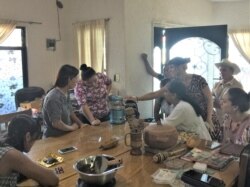 Juliana Desmond teaching women in Mexico how to sculpt chocolate