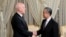 Tunisian President Kais Saied, left, shakes hands with Chinese Foreign Minister Wang Yi on Jan. 15, 2024, in Tunis. (Tunisian Presidency via AP)