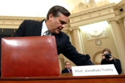 Constitutional law expert George Washington University Law School professor Jonathan Turley arrives to testify during a hearing before the House Judiciary Committee on the constitutional grounds for the impeachment of President Donald Trump.