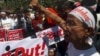 Protesters and Buddhist monks stage a rally against Doctors Without Borders in Sittwe, Rakhine State, western Burma, Feb. 23, 2014.