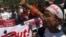 Protesters and Buddhist monks stage a rally against Doctors Without Borders in Sittwe, Rakhine State, western Burma, Feb. 23, 2014.